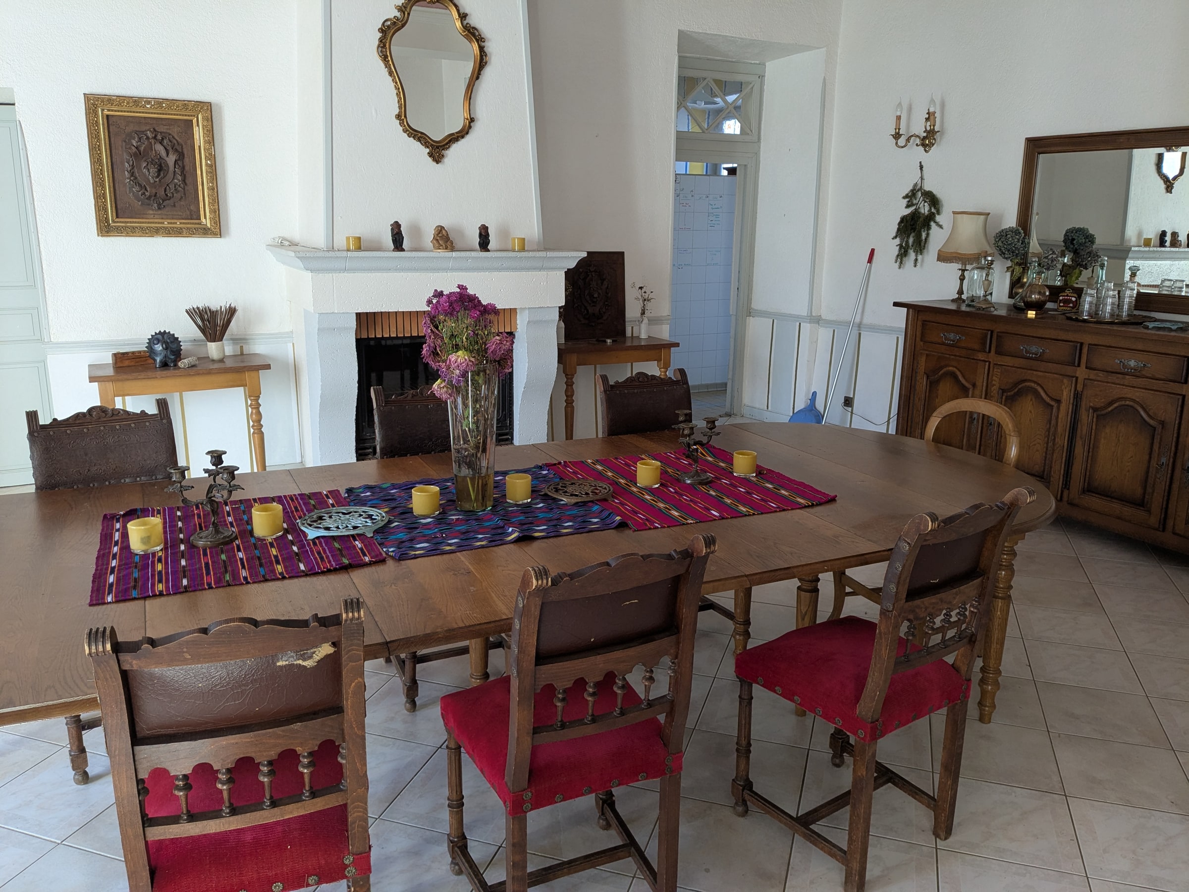 The dining hall with its long table and fireplace
