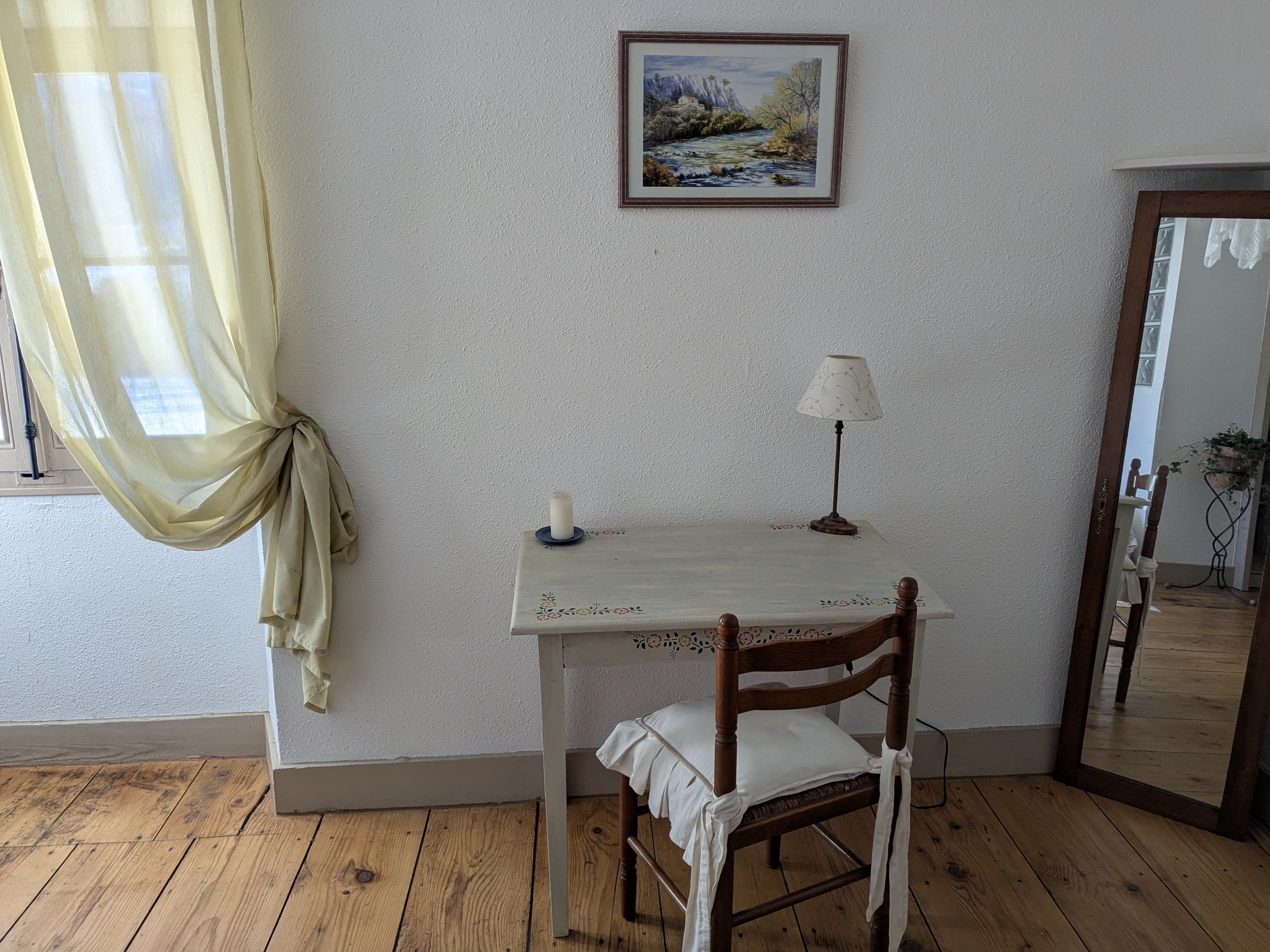 A bedroom with a writing desk